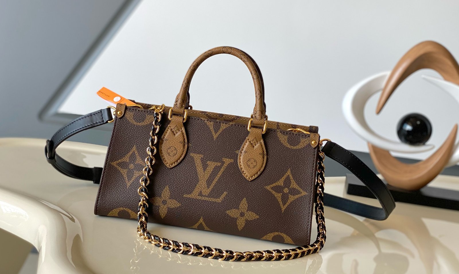 LV OnTheGo East West Monogram Reverse