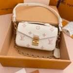 LV Pochette Metis East West Monogram Empreinte Cowhide white with pink flowers
